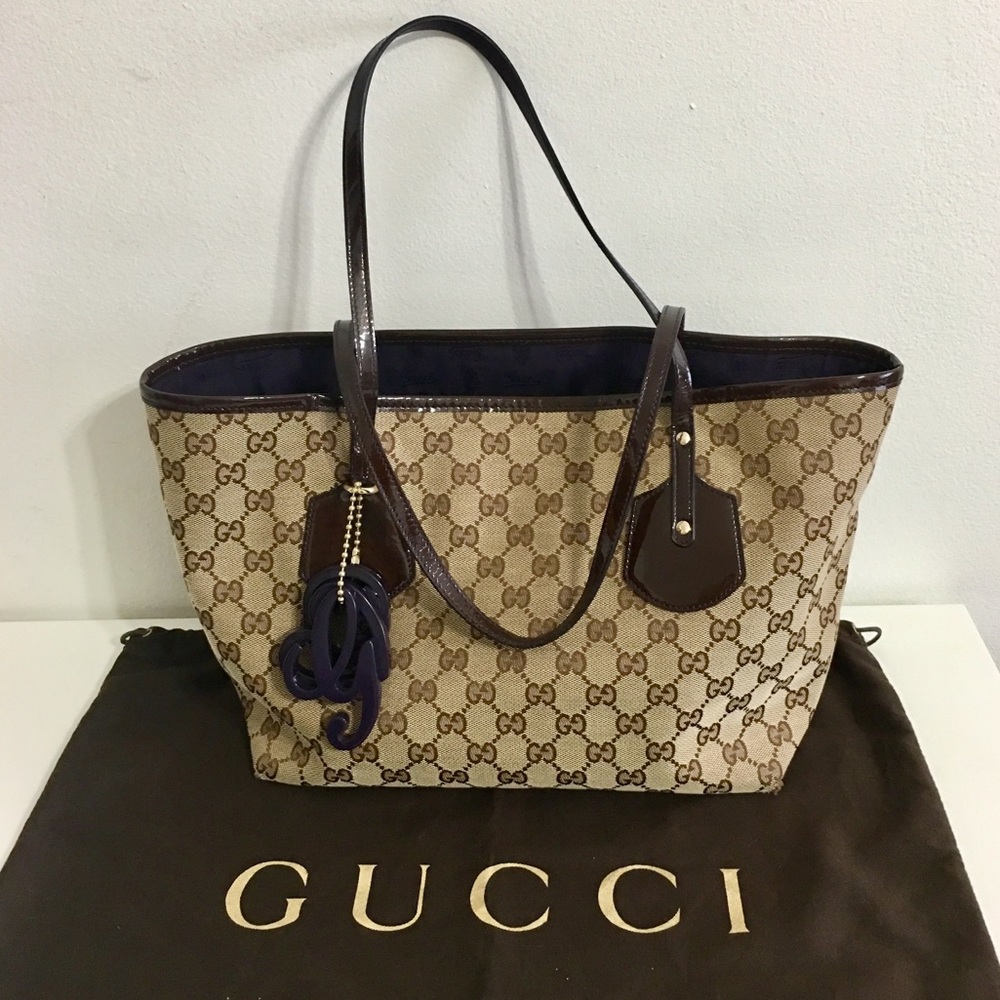 Authentic Gucci monogram canvas tote with charms